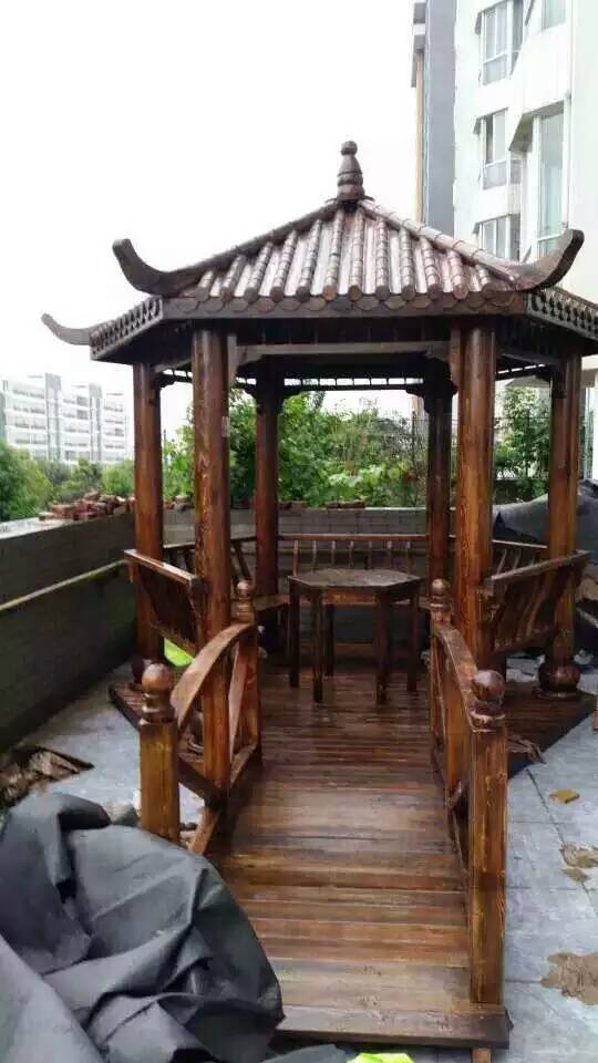 廠家定制碳化仿腐木六角涼亭戶外實(shí)木斗笠涼亭園林庭院乘涼亭子六角亭